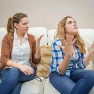 Furious mother arguing with her ​​teenage daughter