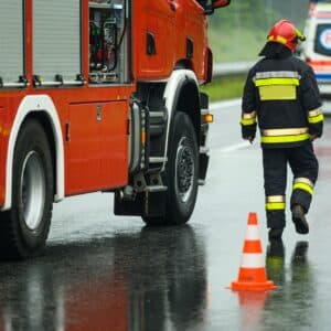 Highway Traffic Accident Site Firefighter Securing Traffic